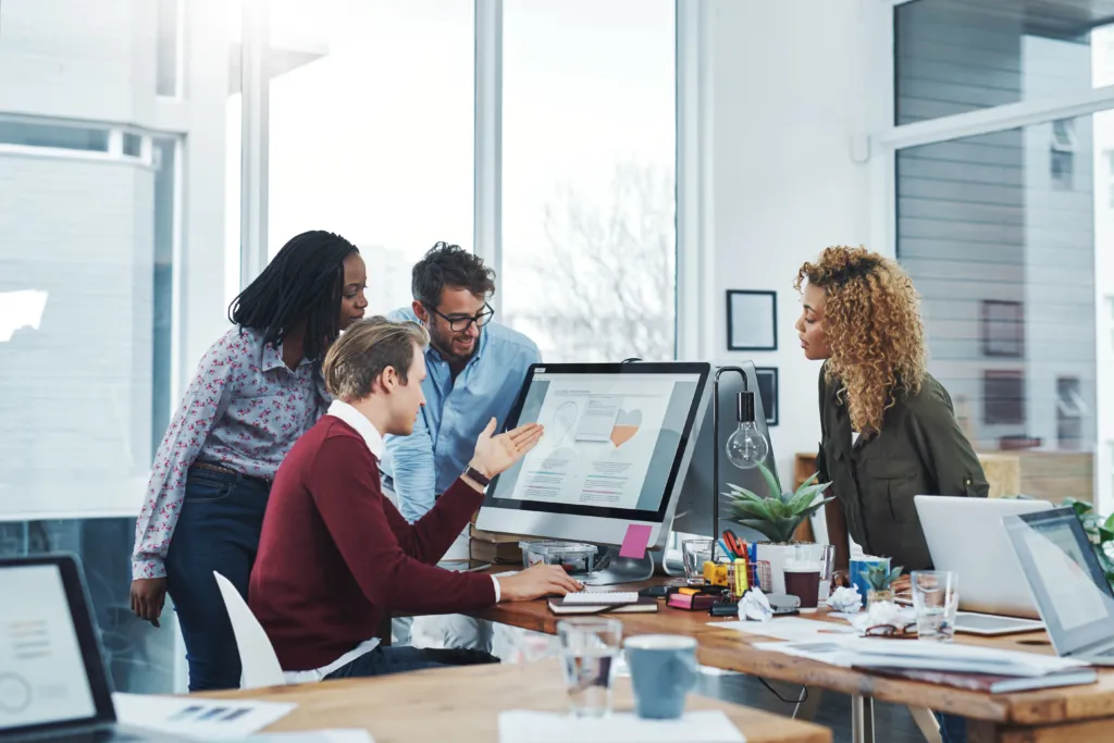 A sales and marketing team reviewing campaign performance dashboards